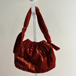 Rust velvet bag from Anthropologie